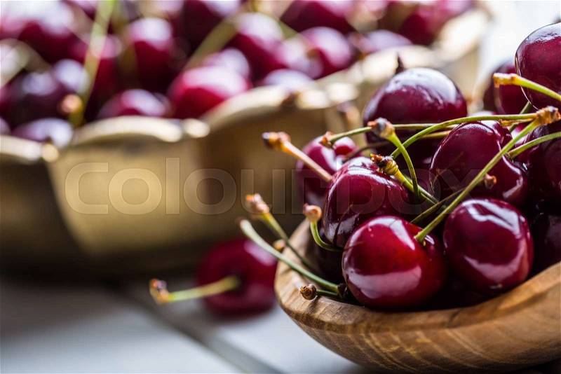 Cherries. Sweet Cherries. Fresh Cherries. Ripe cherries on wooden concrete table - board, stock photo