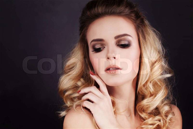 Gorgeous Fashion Model with Makeup and Blonde Curly Hairstyle, stock photo