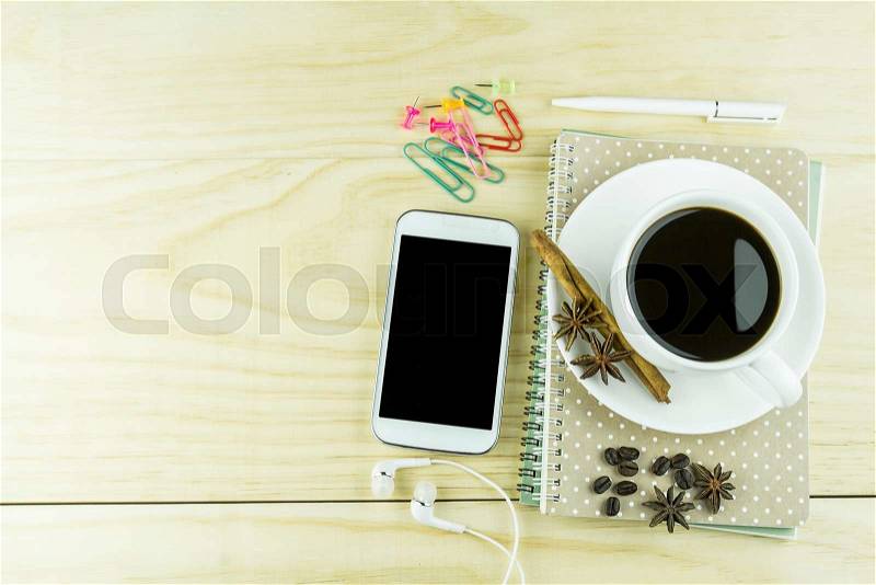 Smart phone, coffee,glasses and book blank with white pen on wood table background. top view, stock photo