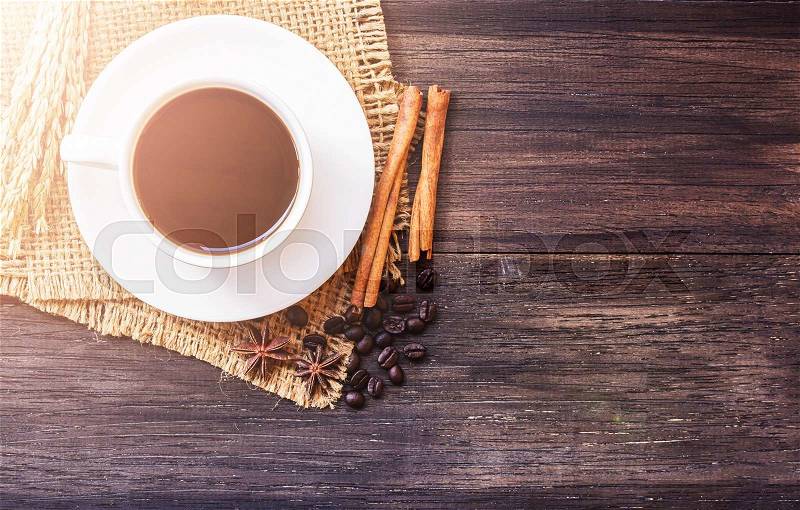 Cup of coffee and ears on dark wooden table background. top view with copy space, stock photo