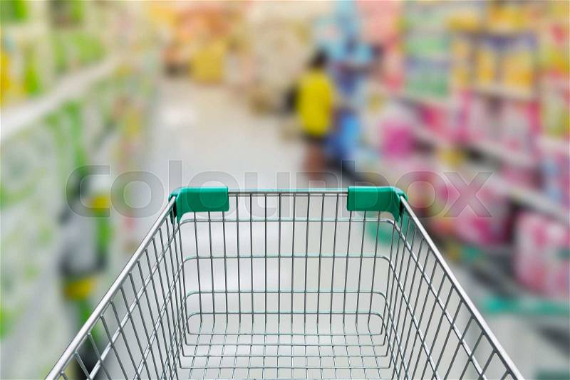 Rear view of empty shopping cart with shopping mall or grocery background, stock photo