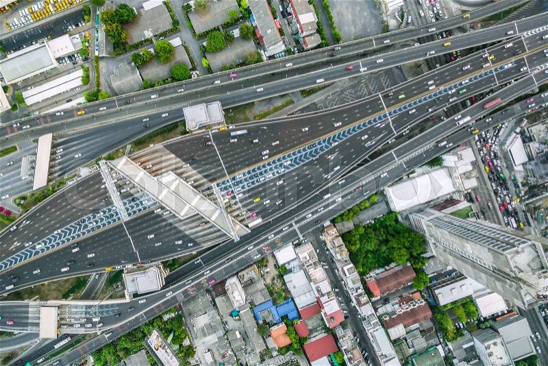 Aerial view of traffic junction and transportation road in city, top and birdeyes view shot 90 degree, blur background, stock photo