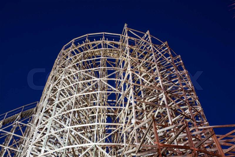 Wooden roller coaster illuminated at night. Kemah Boardwalk, Texas, United States, stock photo