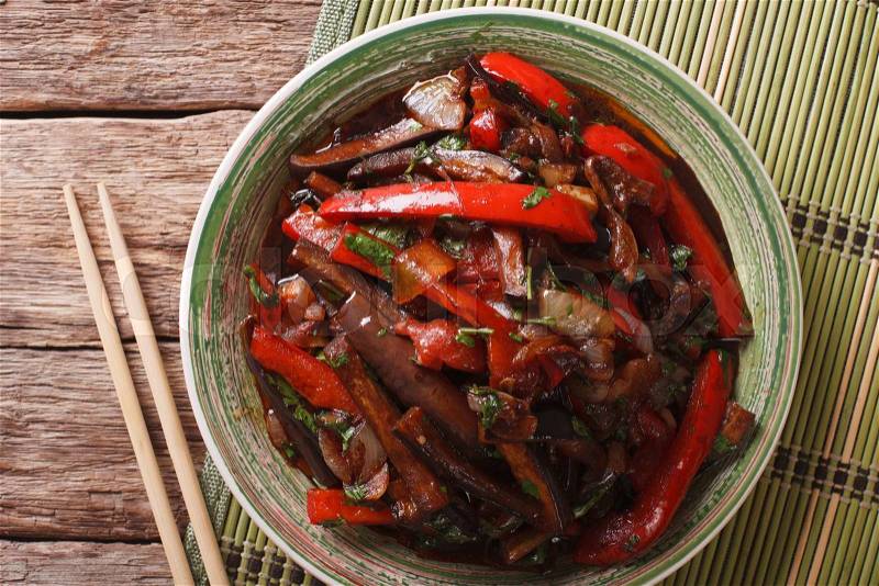 Eggplant Stir-Fry from Asian-style close-up on a plate on the table. horizontal view from above , stock photo