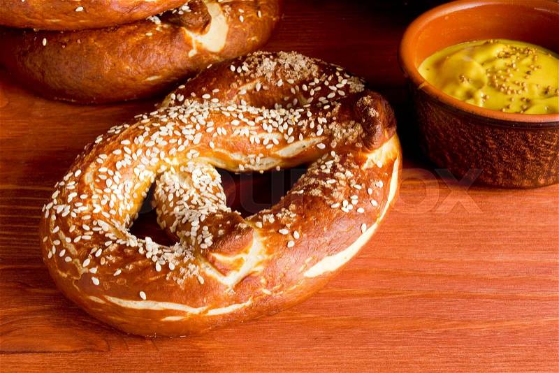 German salty pretzel on a wooden background, stock photo