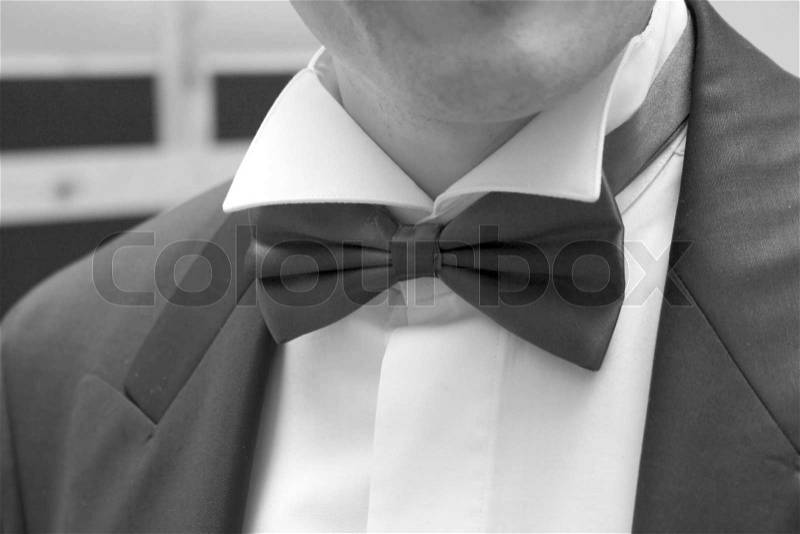Man in black suit with bow tie, stock photo