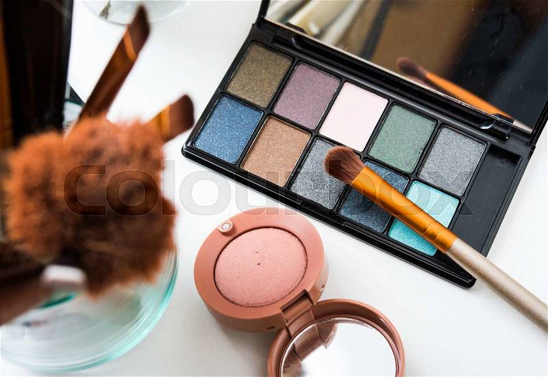 Professional makeup brushes and tools, natural make-up products set on white table, stock photo