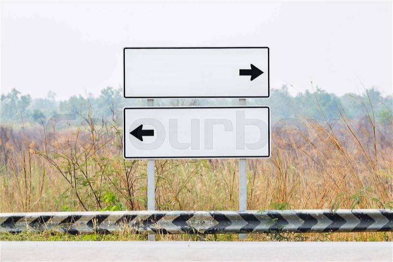 Blank road sign boards with left anf right directional arrow, ready to fill text, stock photo