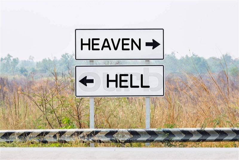 Road sign boards with heaven and hell text, opposite wording concept, stock photo