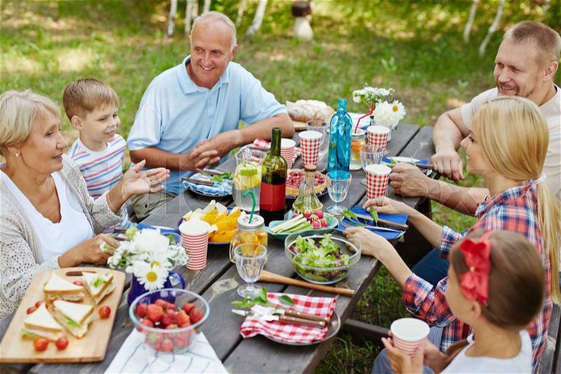 Big family having outdoor picnic, stock photo