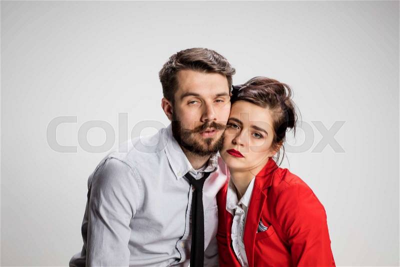 The weary business man and woman on a gray background, stock photo