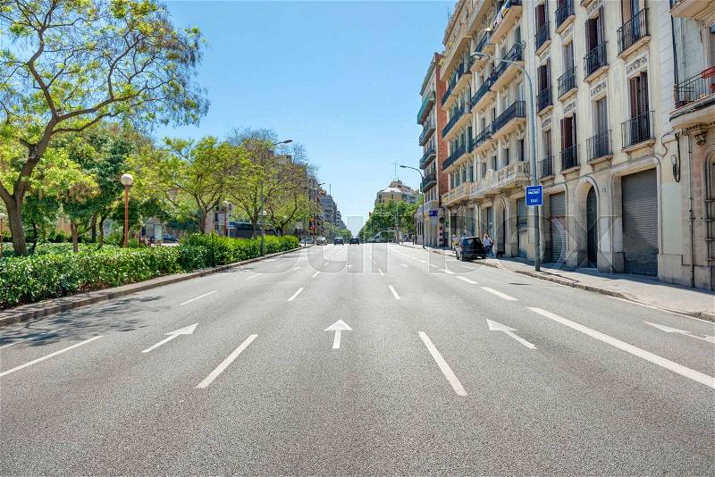 Road on the city street. Cityscape with urban traffic in Barcelona, Spain, stock photo