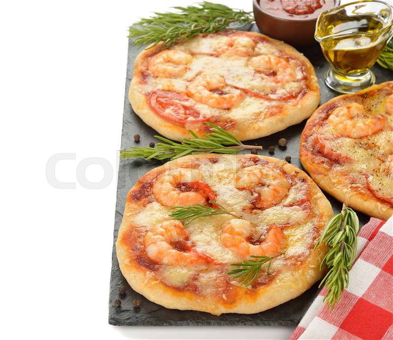 Mini pizza with shrimp and rosemary on a white background, stock photo