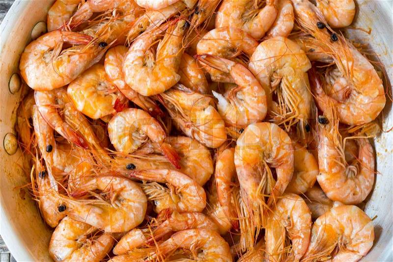 Cooked shrimp in a pan with garlic and spices, stock photo