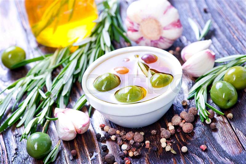 Green olives and olive oil with aroma spice, stock photo