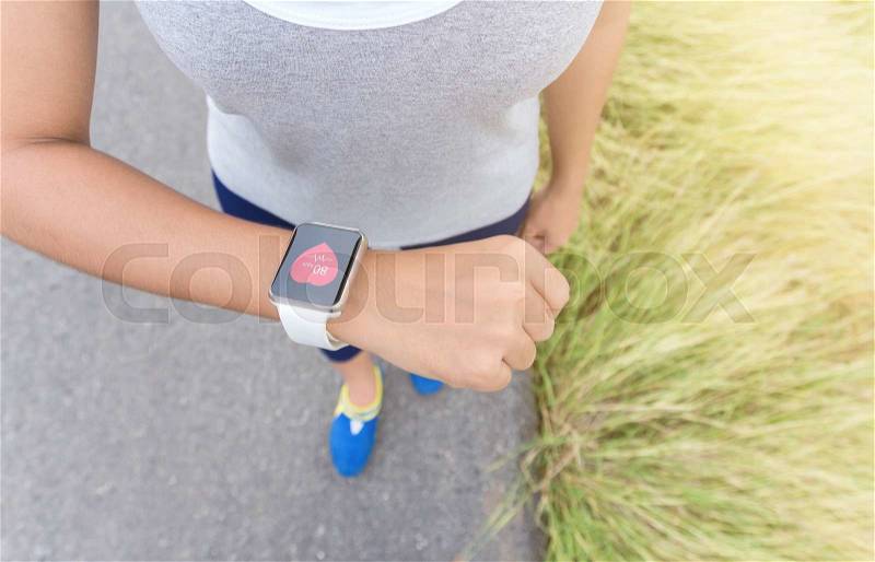 Digital hand watch on sport woman hand, stock photo