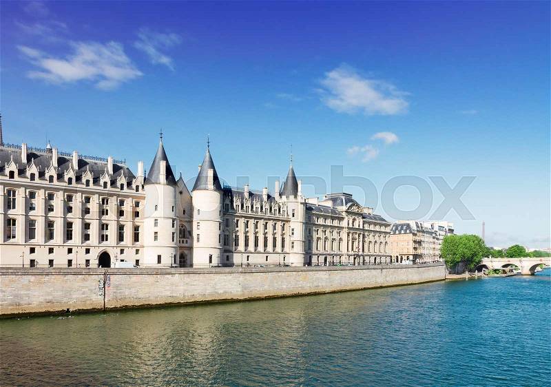 La Conciergerie - ex royal palace and prison over river Seine river at summer day, Paris, France, stock photo