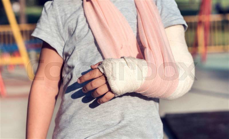 Little child with broken hand and cast,selective focus, stock photo