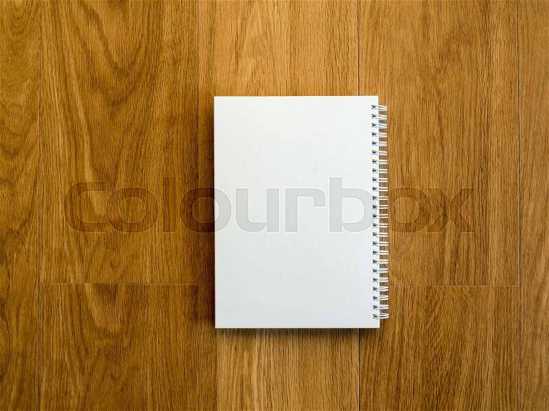 Empty notebook cover on wooden vintage table with copy space, stock photo
