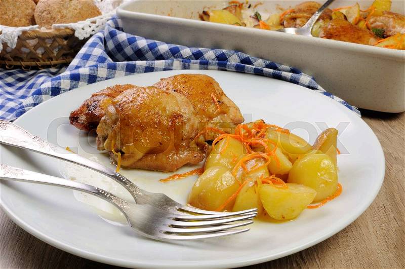 Portion fried pieces chicken with boiled potatoes and carrots , stock photo