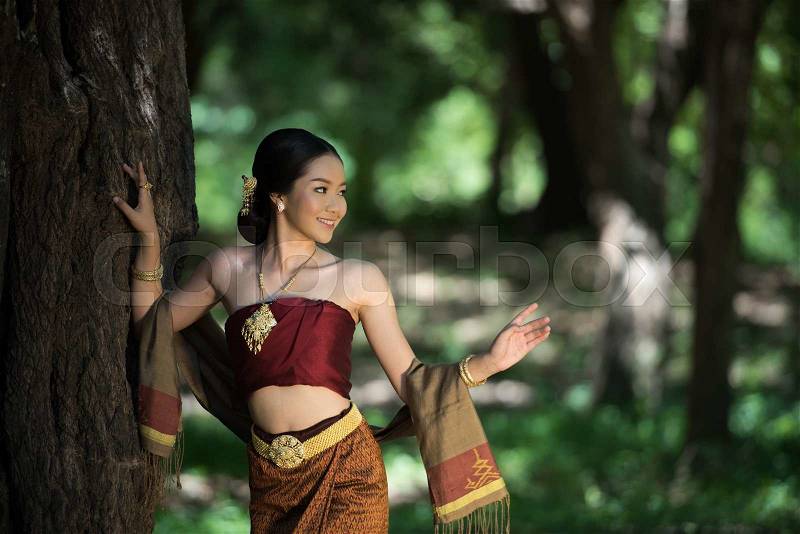 Thai women welcome with traditional Thai suit, stock photo