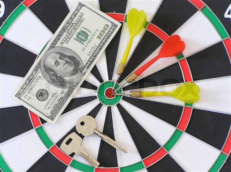 Darts with money, and with keys, stock photo