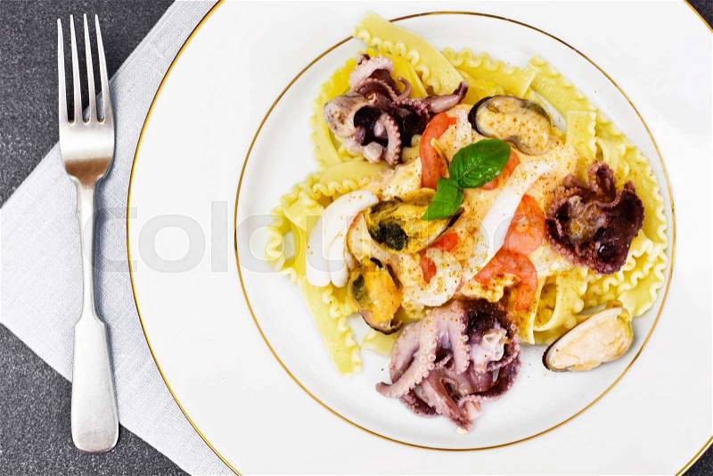 Pasta with White Sauce and Seafood Studio Photo, stock photo