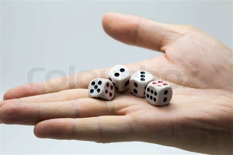 Human hand ready to roll the dice on white isolated background - Try luck, Take Risk or Business concept (Focus on dices), stock photo