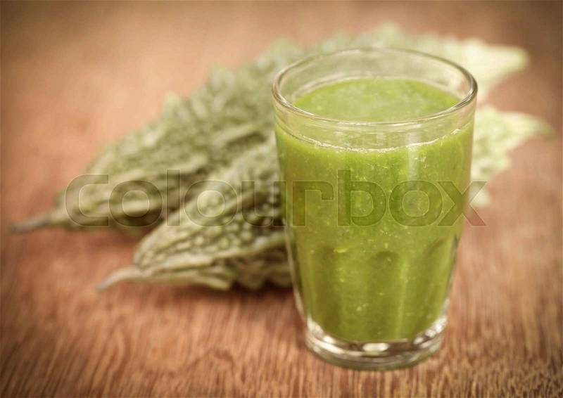 Herbal juice of green momodica with green vegetable, stock photo