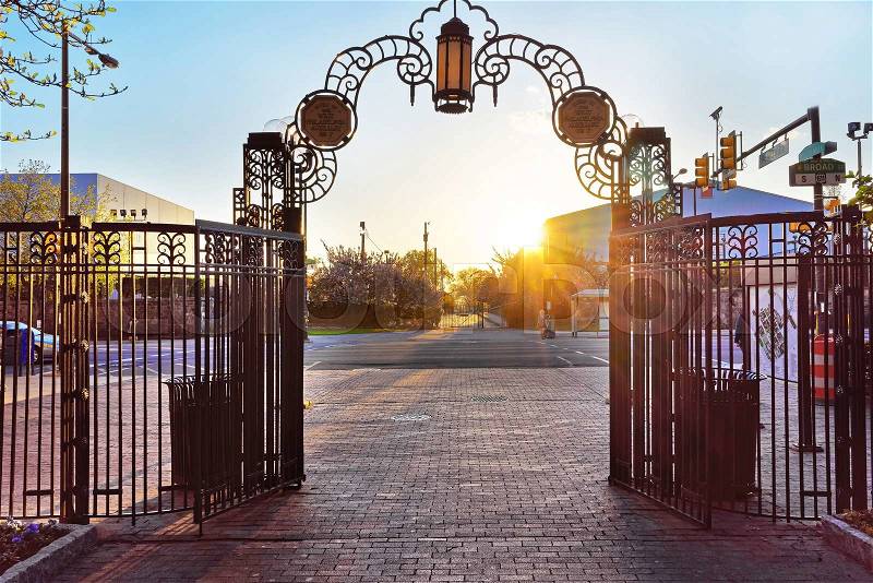 Romantic sunset seen from the gate in Broad Street in Philadelphia, Pennsylvania, the USA, stock photo