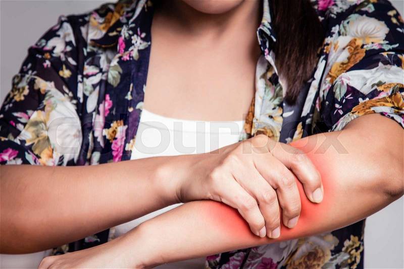 Asian woman having arm pain ,clutching the arm, stock photo