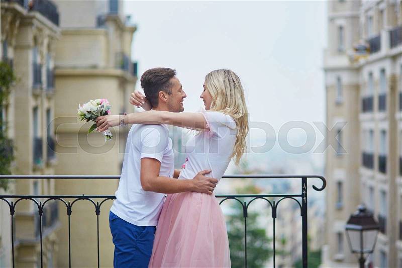 Romantic couple walking on Montmartre in Paris, France, stock photo