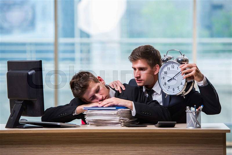 Two twins businessmen arguing with each other over deadline, stock photo