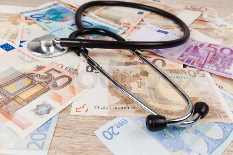 Euro banknotes and stethoscope. Health care cost. medical concept, stock photo