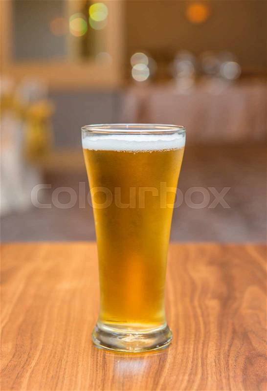 Glass of beer in pub and restaurant, stock photo