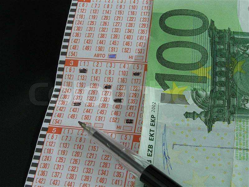 On a photo the lottery ticket, the handle and money for the rate. The photo is made in Ukraine, stock photo
