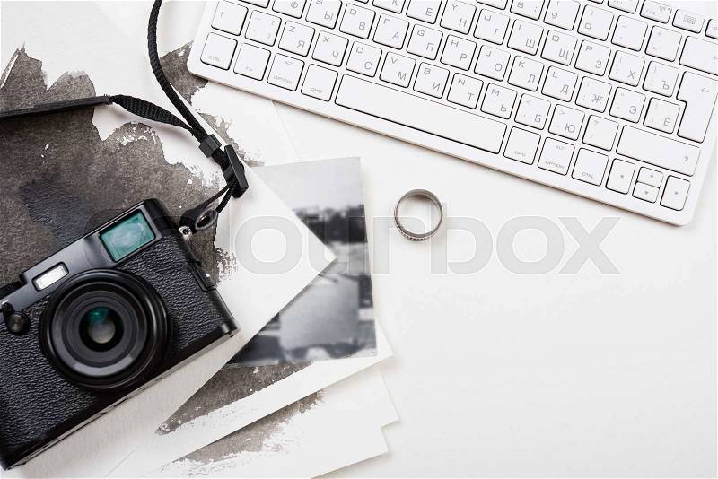 Styled tabletop with computer keyboard and retro camera on white background, photographer artist workspace, stock photo