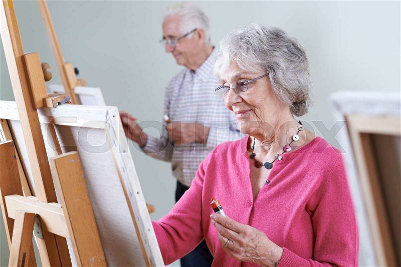 Seniors Attending Painting Class Together, stock photo