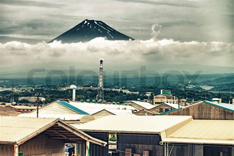 Mount Fuji with countryside homes in foreground, stock photo