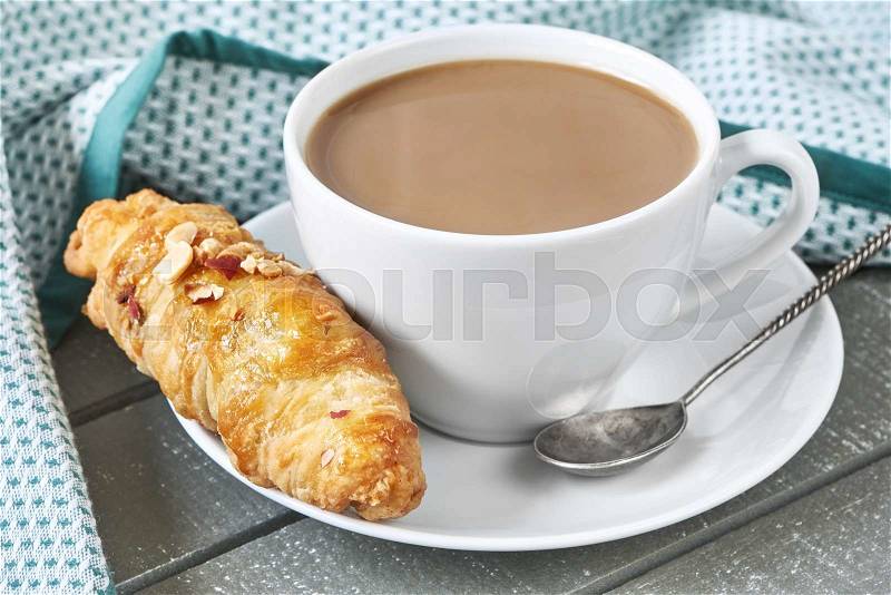 Coffee with milk and croissant on breakfast, stock photo