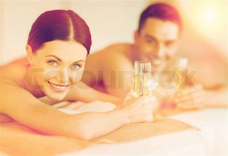 Picture of couple in spa salon drinking champagne, stock photo