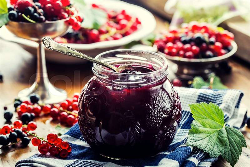 Red and black currants. red currant jam with fresh berry, stock photo