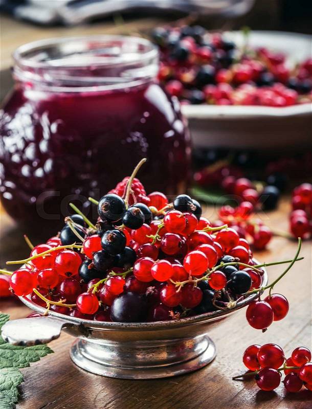 Red and black currants. red currant jam with fresh berry, stock photo