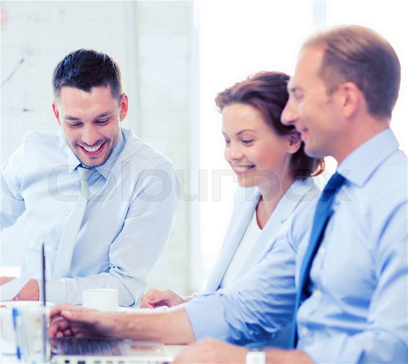 Friendly business team having meeting in office, stock photo