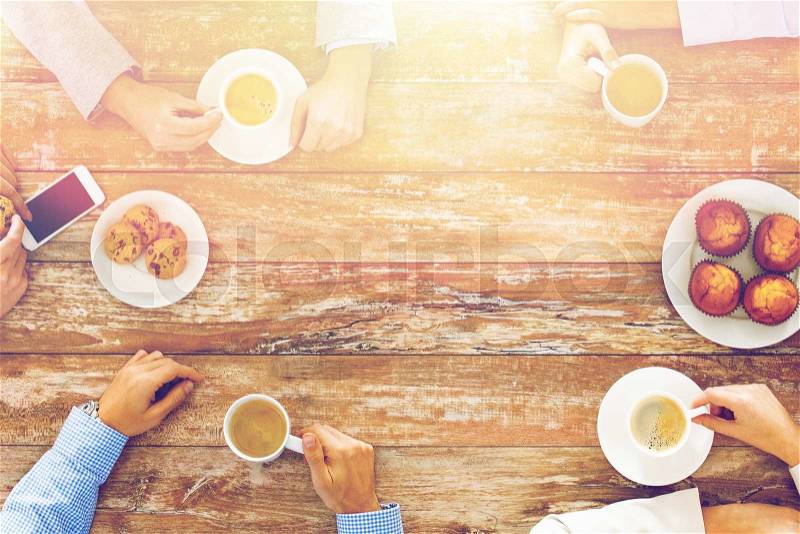 Business, people and team work concept - close up of creative team meeting and drinking coffee during lunch in office, stock photo