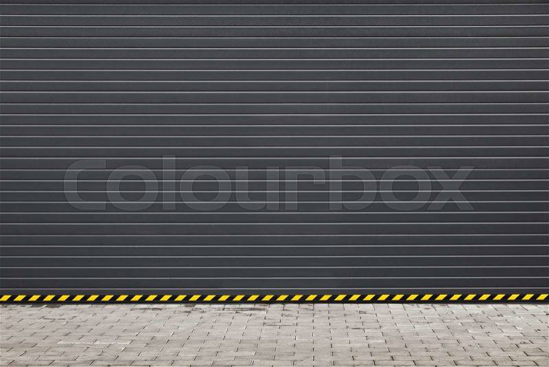 Dark gray modern rolling shutter garage gate, background photo texture, stock photo