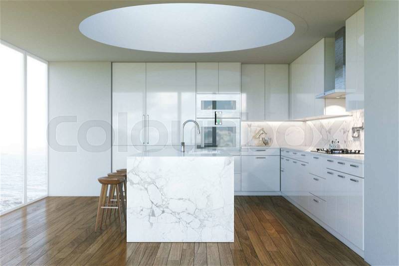 White Contemporary Kitchen in new Interior with beautiful view to ocean beach, stock photo