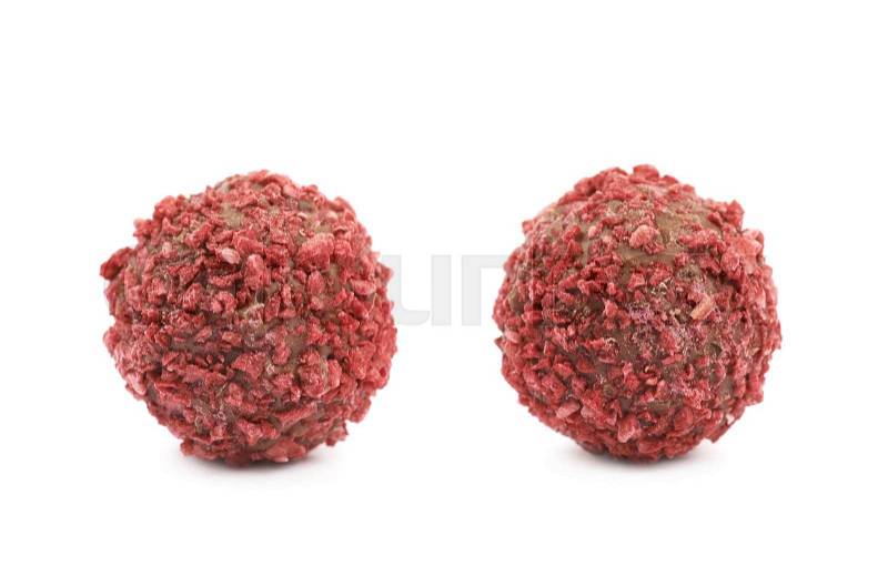Single handmade red candy ball isolated over the white background, set of two different foreshortenings, stock photo
