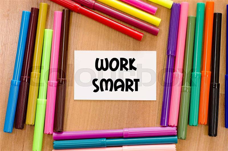 Work smart written on memo over wooden background, stock photo