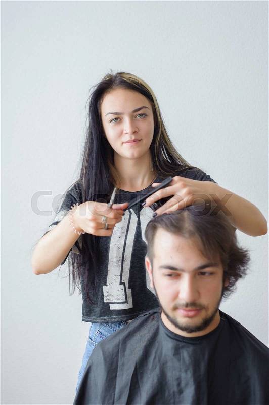 Men\'s hairstyling and haircutting in a barber shop or hair salon, stock photo
